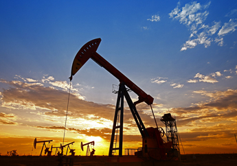 Pump jacks at work extracting oil from the ground