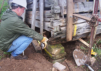 Historic preservation staff member completing assessing an historic property