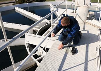 MoDNR staff member collects drinking water sample from a drinking water treatment plant