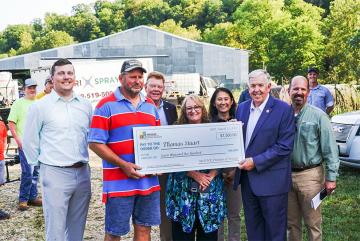 Energize Missouri Agriculture Program big check Thomas Stuart, Craig Redmon, Tracy Parker, Emily Wilbur, Governor Mike Parson, success story Sept. 13, 2022