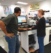 MoDNR staff providing compliance assistance to a small business owner